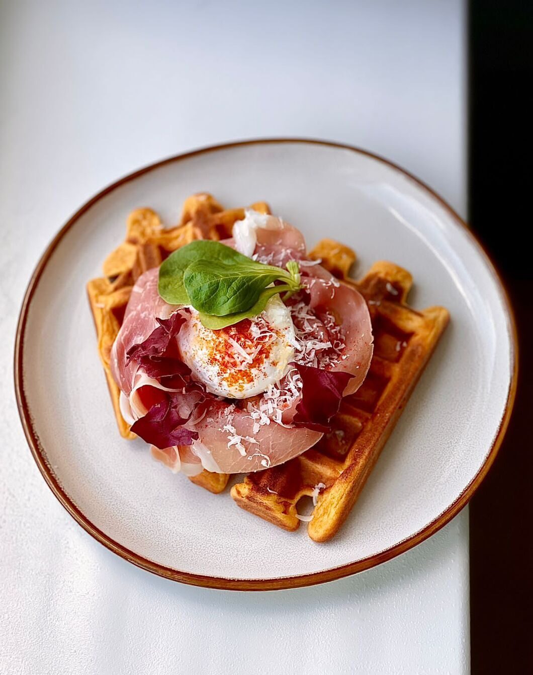       PUMPKIN WAFFLES WITH POACHED EGG AND HAM      